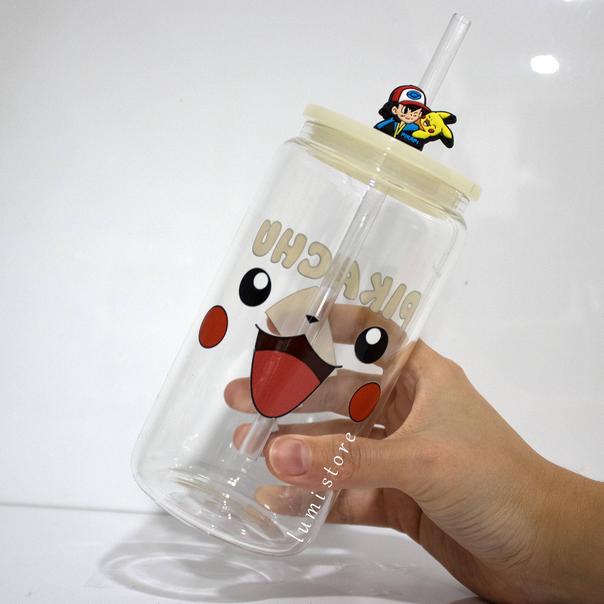 Pikachu Glass Tumbler – a Pokemon-inspired 16oz glass cup! 🐉💖 Perfect for Pokemon lovers or a delightful self-indulgence. Each cup is HANDMADE, ensuring a unique piece. Elevate your sipping experience with this Glass Cup featuring a Colorful Lid and Reusable Straw.
