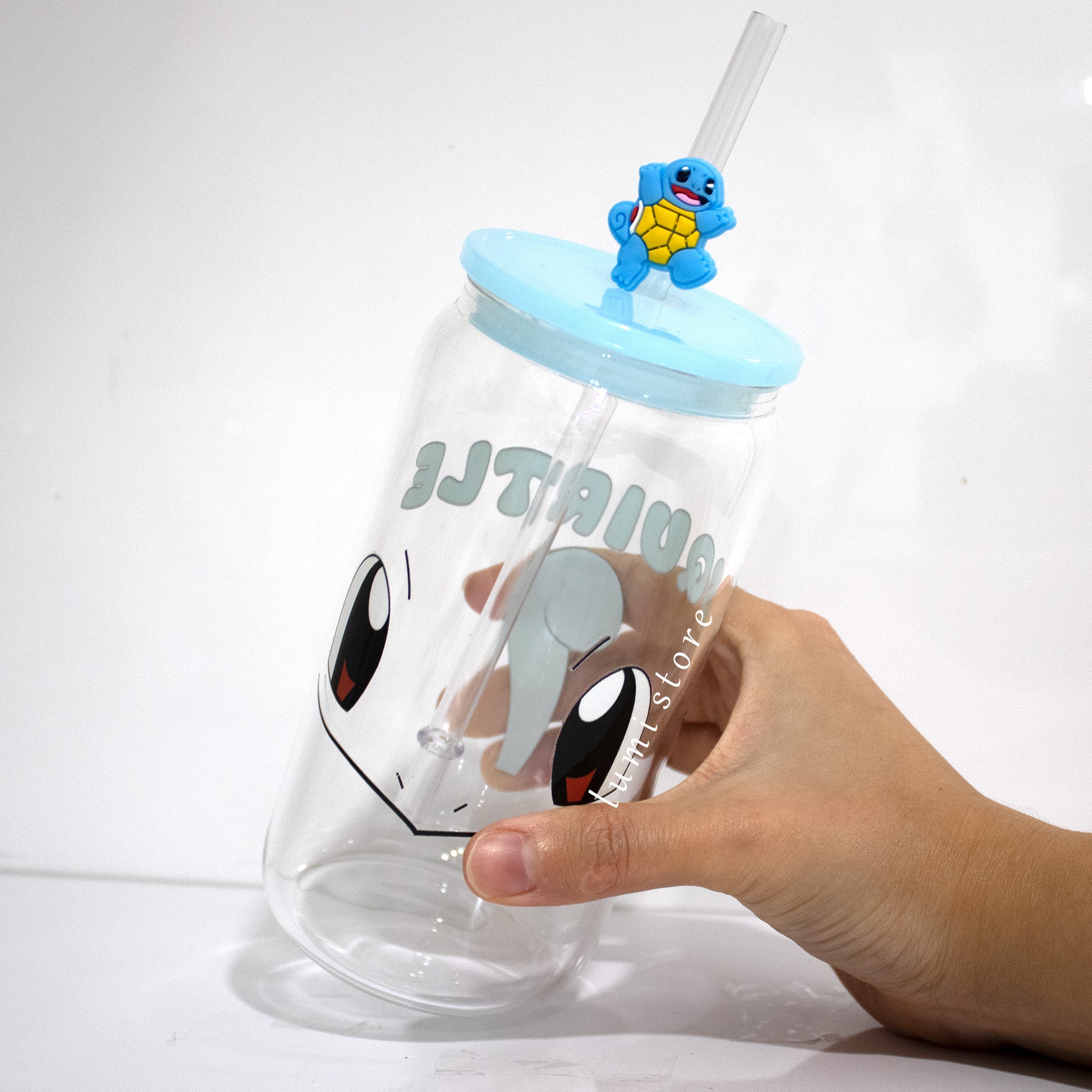 Squirtle Glass Tumbler – a Pokemon-inspired 16oz glass cup! 🐉💖 Perfect for Pokemon lovers or a delightful self-indulgence. Each cup is HANDMADE, ensuring a unique piece. Elevate your sipping experience with this Glass Cup featuring a Colorful Lid and Reusable Straw.