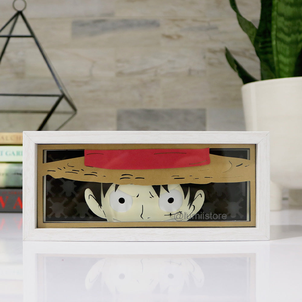 Discover our captivating 'One Piece Luffy Lightbox', an ideal collector's item for anime enthusiasts. This vibrant lightbox highlights Monkey D. Luffy's iconic straw hat and fearless persona, brilliantly illuminated to bring the character to life. Perfect for 'One Piece' fans and anime art collectors, it's a striking decor addition that embodies the adventurous spirit of the beloved series.