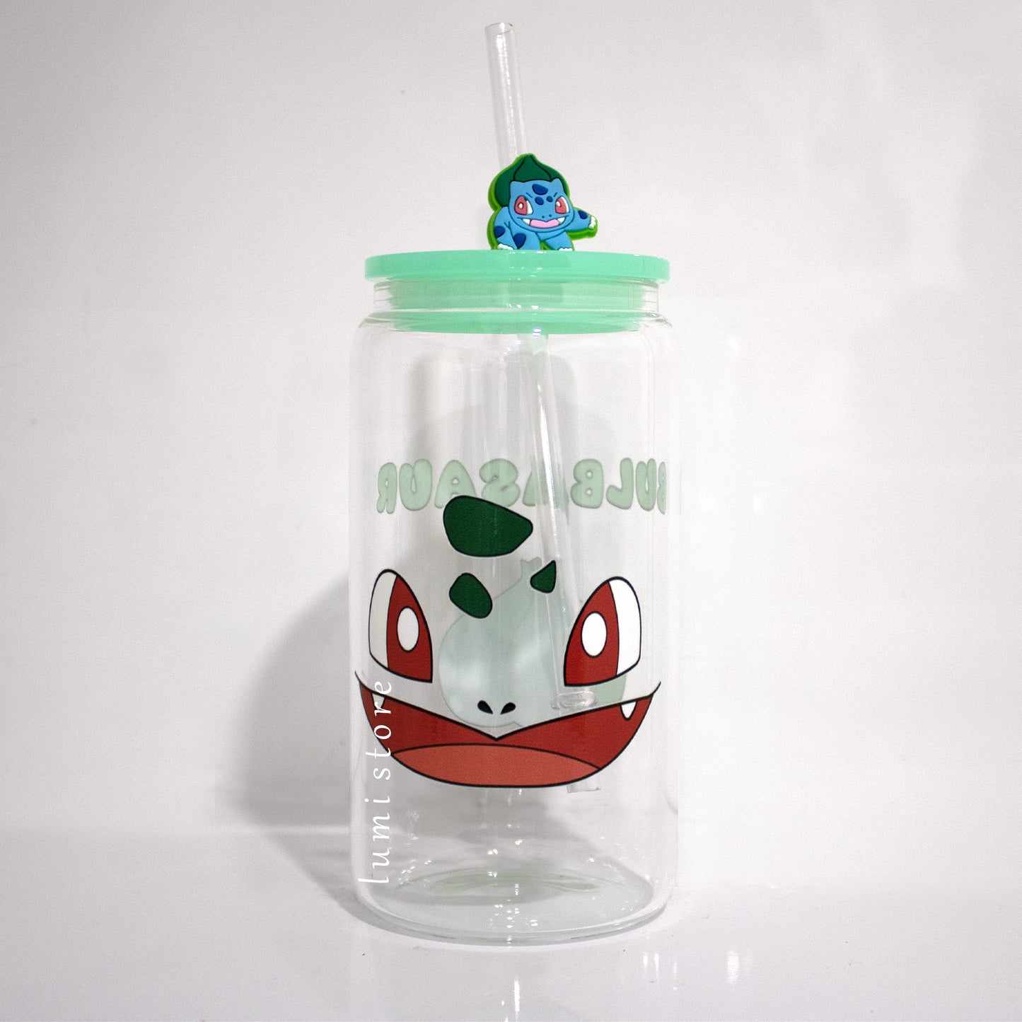 Bulbasaur Glass Tumbler – a Pokemon-inspired 16oz glass cup! 🐉💖 Perfect for Pokemon lovers or a delightful self-indulgence. Each cup is HANDMADE, ensuring a unique piece. Elevate your sipping experience with this Glass Cup featuring a Colorful Lid and Reusable Straw. 