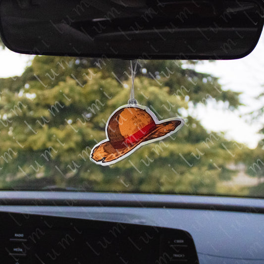 Air freshener with a design of Luffy's iconic straw hat from One Piece.