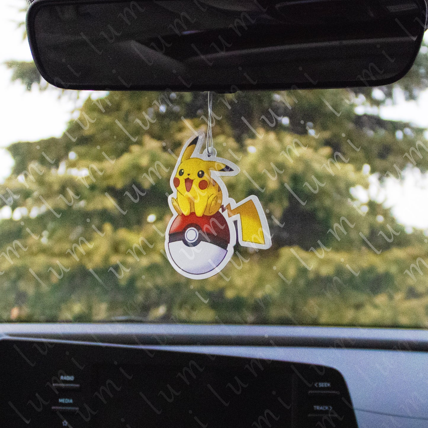 Image of a Pikachu air freshener with a pokeball design, suitable for use in a car or other small spaces. The air freshener features a cute and colorful Pikachu on a pokeball, surrounded by fresh-scented aroma.